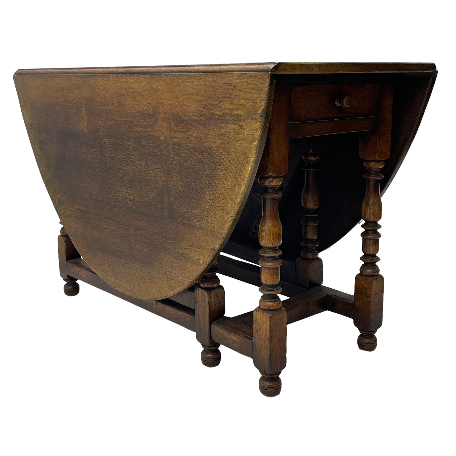 18th century oak dining table, oval drop-leaf top on gate-leg action base, turned supports united by turned stretchers, fitted with single end drawer