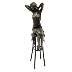 Art Deco style bronze modelled as a female figure seated upon a chair, after 'Pierre Collinet', H28cm