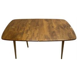 Ercol - light elm and beech 'Slide Leg Expanding Dining Table (444)', rectangular top with rounded corners, raised on tapered splayed supports, with two additional leaves