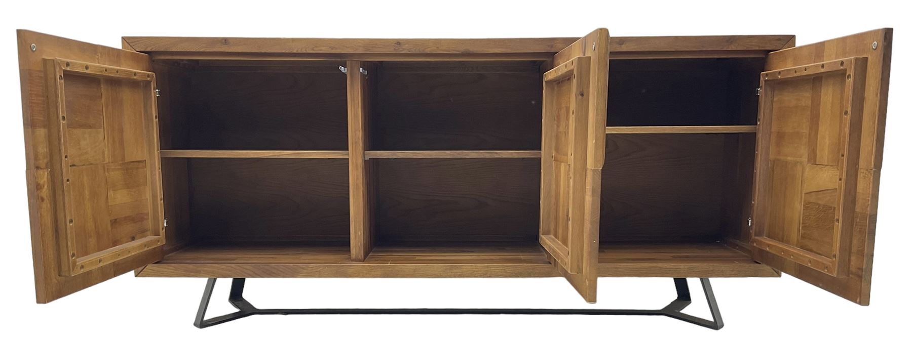 Samba 'Camden' oak sideboard, rectangular top over three block panelled cupboard doors, raised on angled black metal supports connected with stretcher