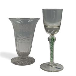 19th century continental liqueur glass, circa 1870, bucket bowl with bubble decoration, the tapered stem with green and white strands, H12.5cm; together with a Victorian aperitif glass, trumpet bowl decorated with foliate and fruiting vines, H10cm (2)