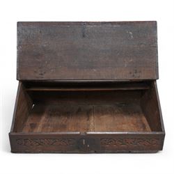 Early 18th century oak bible box, sloped hinged lid inscribed '1703 P.B', the front and sides carved with foliate scroll bands