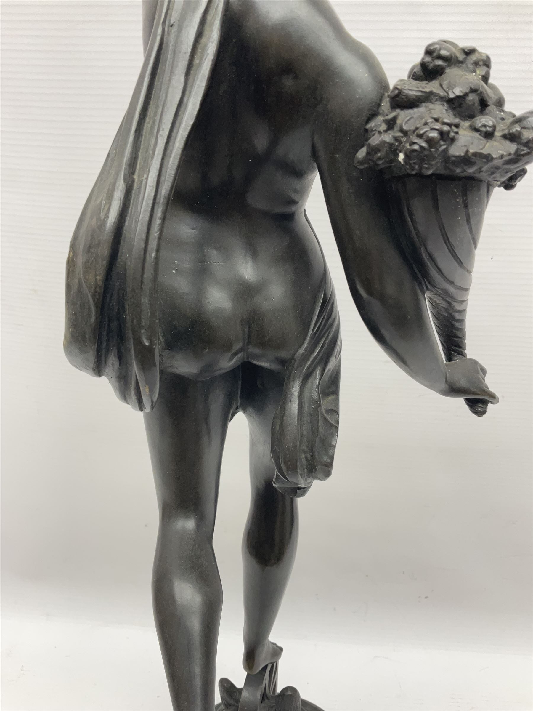 After Louis Guillaume Fulconis, a bronzed figure of Fortuna with cornucopia in her right hand and standing on a wheel on green serpentine base, height 60cm