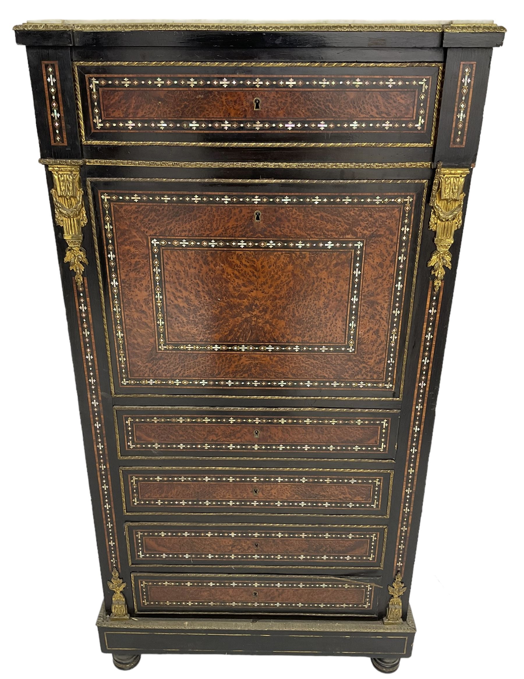 Late 19th century French ebonised and amboyna secrétaire à abattant, white marble top over frieze drawer, fall front and four further drawers, inlaid with trailing pattern in mother of pearl, mounted by cast gilt metal brackets with floral festoons, plinth base with foliate mounted edging and brass stringing, on turned feet 