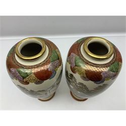 Pair of Japanese Meiji period Satsuma vases, decorated with scenes of procession within a mountainscape, with signature beneath, H25cm