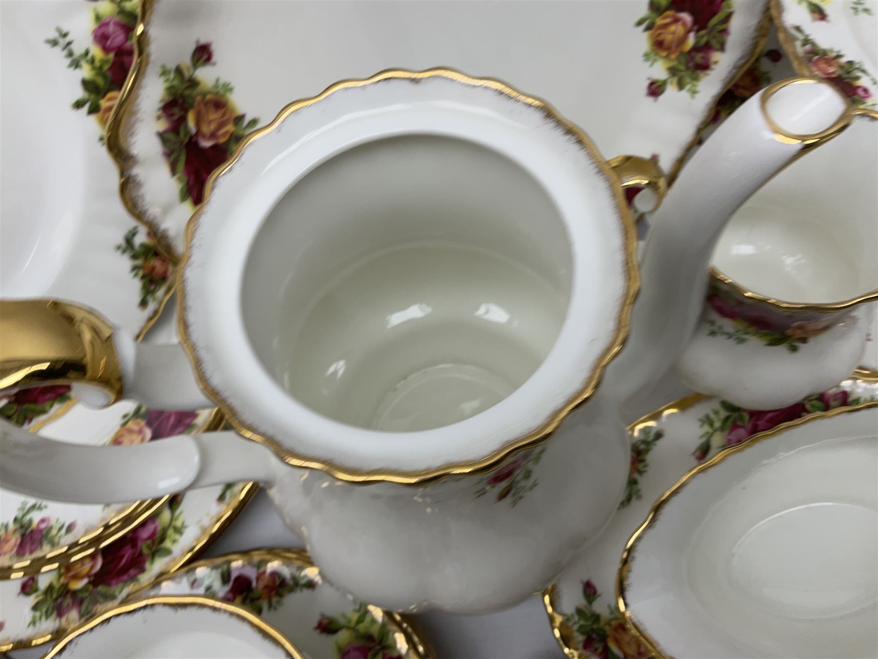 Royal Albert Old Country Roses pattern coffee service for six, comprising coffee pot, milk jug, cups and saucers, cake plate, together with miniature teapot, six teacups and saucers, six dinner plates, six side plates etc 