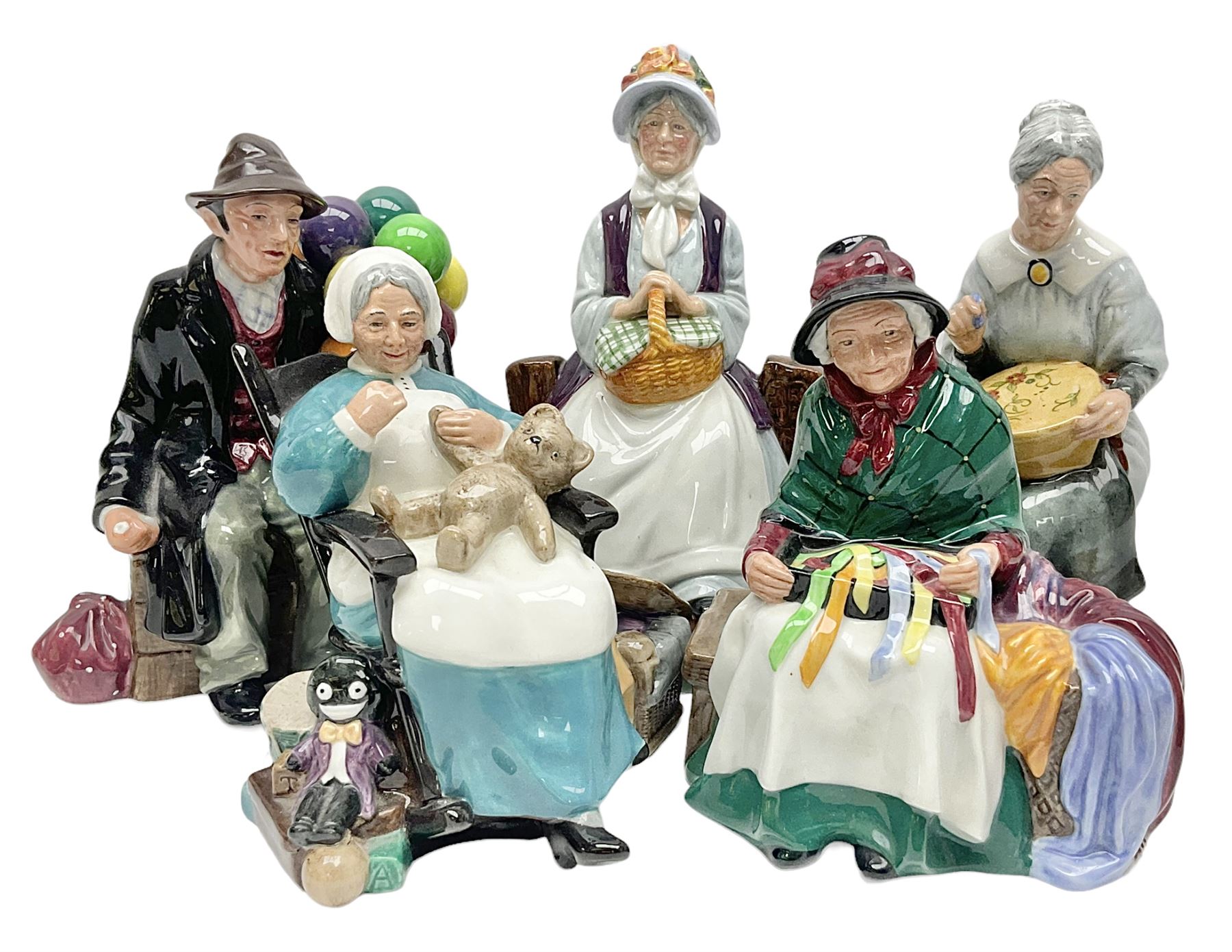 Five Royal Doulton figures, comprising The Balloon Man HN1954, Silks and Ribbons HN2017, Embroidering HN2855, Nanny HN2221 and Rest Awhile HN2728 