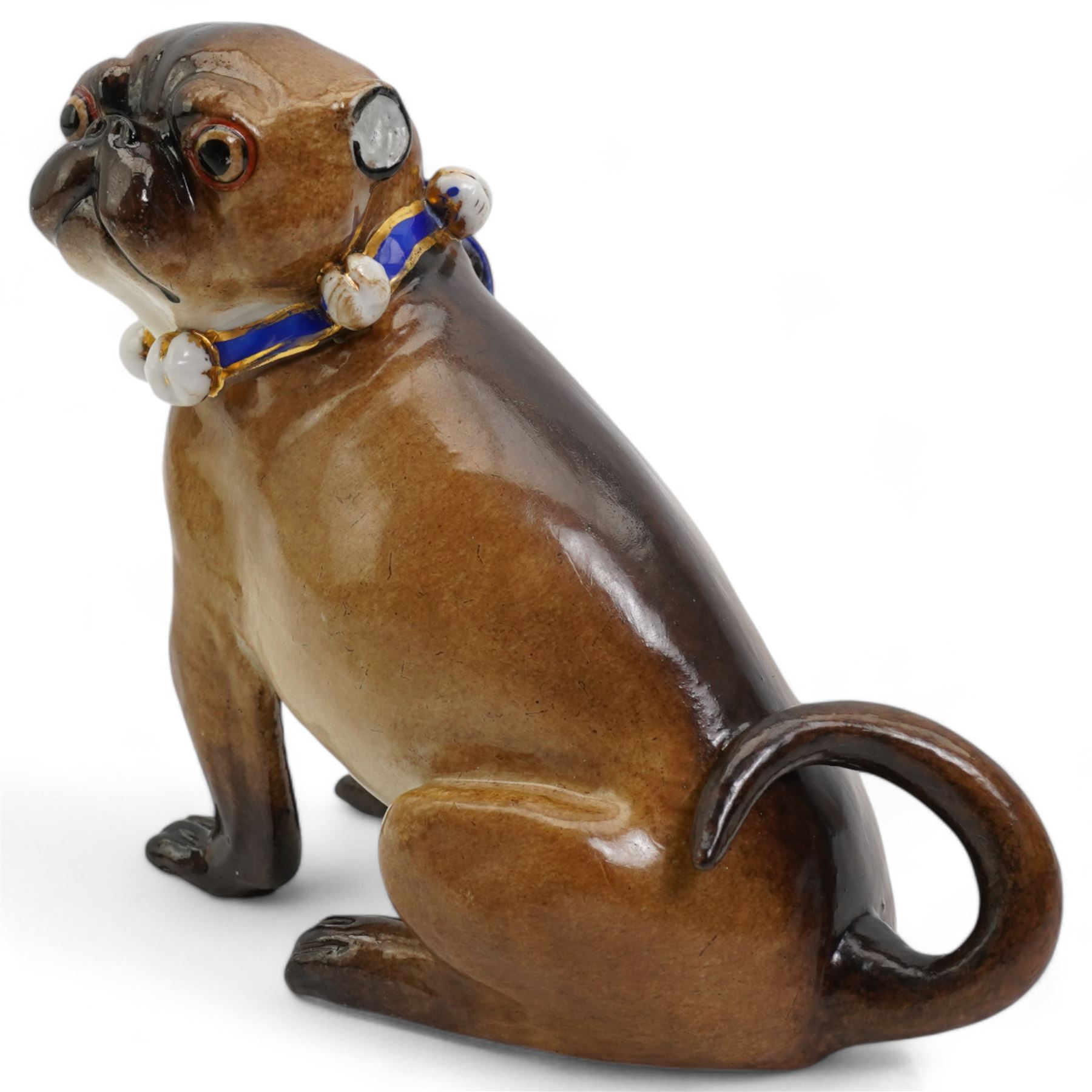 German porcelain model of a Pug, wearing a blue and gilt collar with bells, after J J Kändler, H12cm 