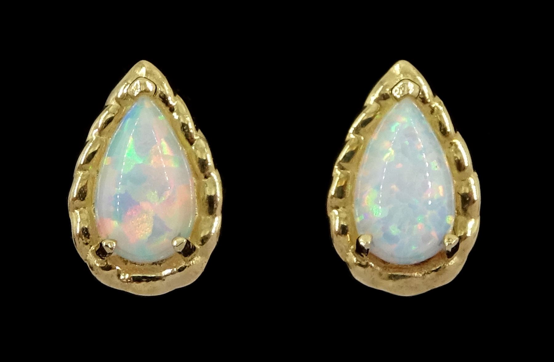 Pair of 9ct gold pear opal stud earrings, stamped