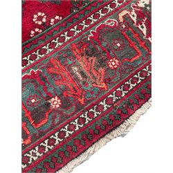 Persian Meymeh red ground rug, stepped lozenge medallion and spandrels, decorated all over with tree of life motifs, the main border decorated with repeating stylised plant motifs within geometric guard stripes 