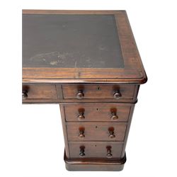 Victorian mahogany twin pedestal desk, moulded rectangular top with inset leather writing surface, nine drawers each fitted with two turned handles, on moulded plinth base 