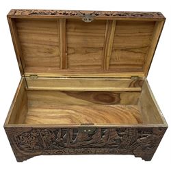 Chinese carved camphor wood blanked chest, rectangular hinged top, carved all over with traditional dragon motifs and junk ships