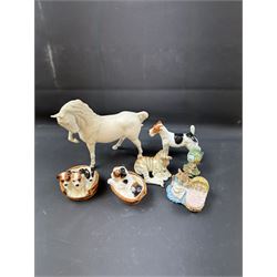 Two Royal Doulton figures of puppies in baskets, together with Beswick horse and other animal figures