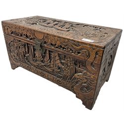 Chinese carved camphor wood blanked chest, rectangular hinged top, carved all over with traditional dragon motifs and junk ships