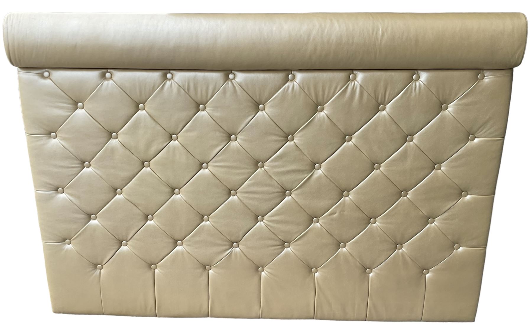 Large padded headboard, upholstered in beige buttoned faux leather