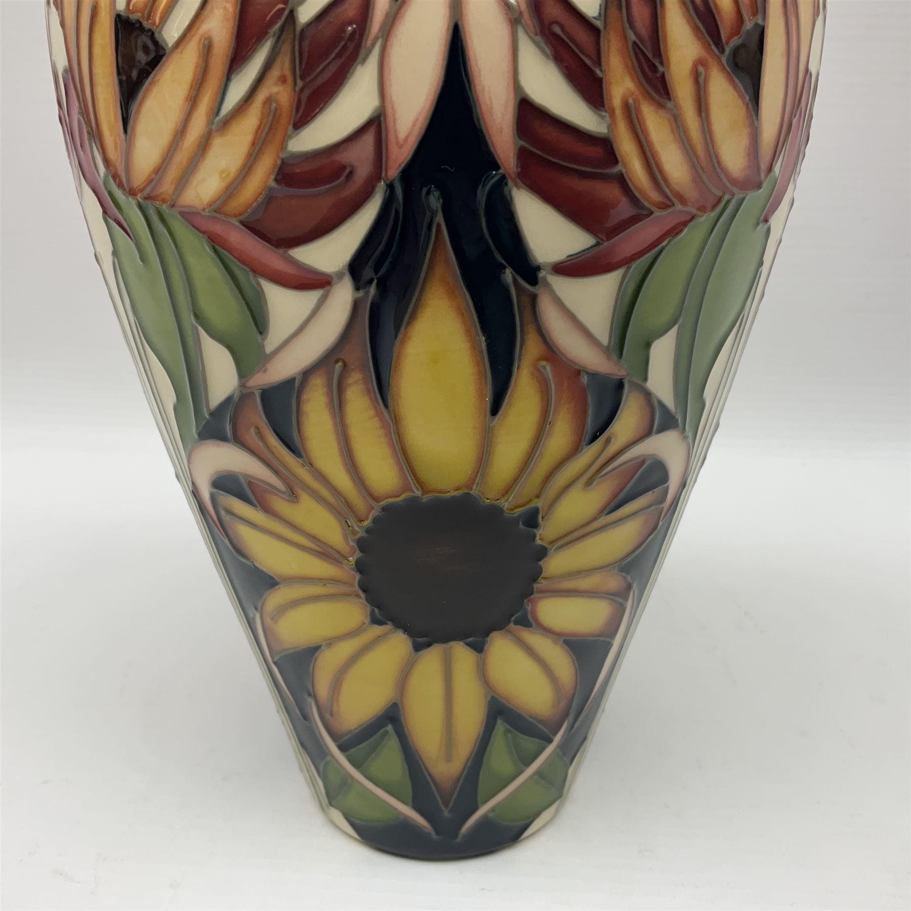 Moorcroft Sunflower vase, 2018 trial, of baluster form with fluted rim, tubelined and painted with sunflowers, on a cobalt blue ground, impressed and painted marks beneath, H23.5cm