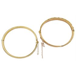 Gold hinged bangle, with engraved floral decoration, Birmingham 1972 and one other gold bangle, both hallmarked 9ct