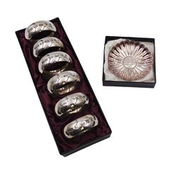 Set of six modern silver napkin rings, hallmarked London 2000, makers mark WW, together with a modern silver pin dish, hallmarked Hugh Crawshaw, Sheffield 2000, both boxed