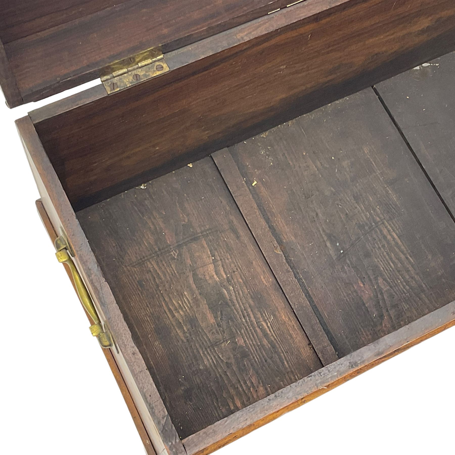 19th century teak blanket chest, hinged lid over plain front, fitted with brass carrying handles on plinth base 