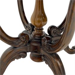 Unusual Victorian figured walnut drop-leaf Sutherland table, moulded drop-leaf oval top, central turned baluster column with quadruple moulded S-scroll supports carved with acanthus leaves, four out-splayed supports with scroll carved terminals, double gate-leg action base, on castors