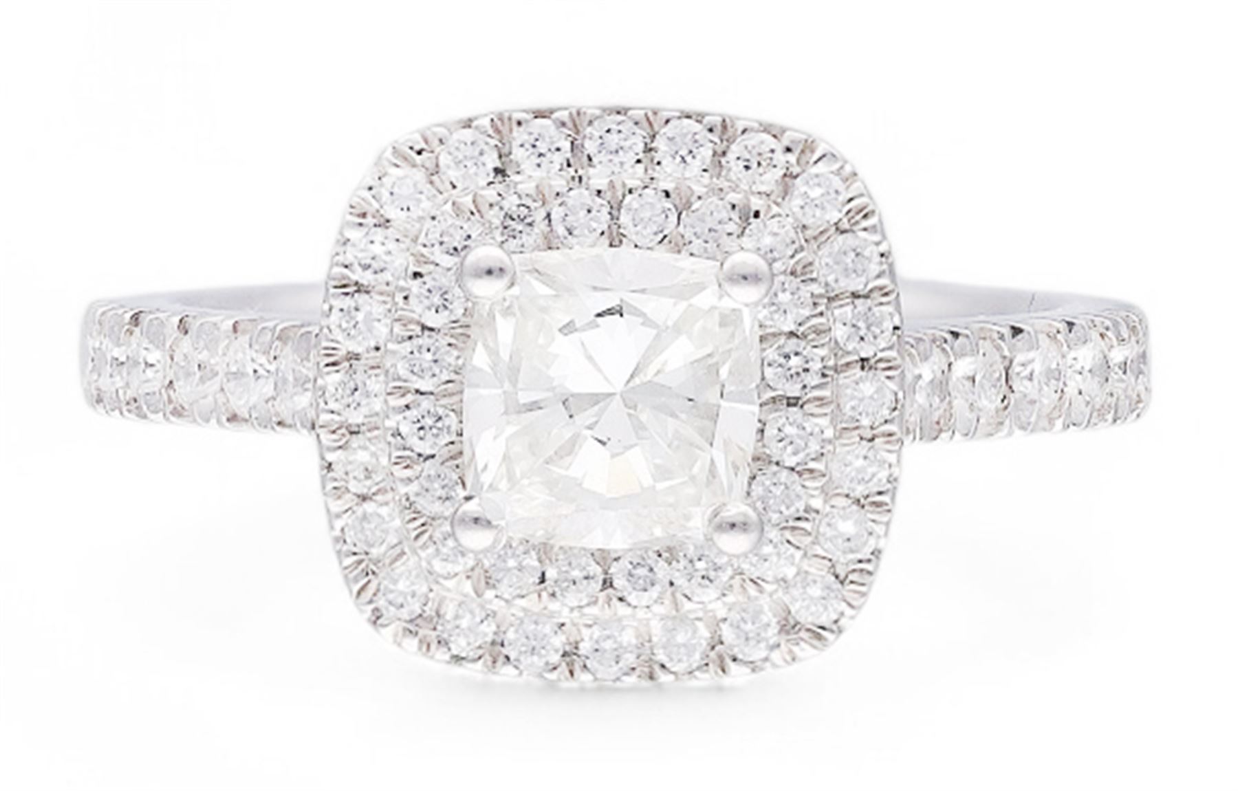 Platinum diamond halo cluster ring, the principal cushion cut diamond of 1.00 carat, with round brilliant cut diamond surround and diamond set shoulders, hallmarked, total diamond weight approx 1.45 carat