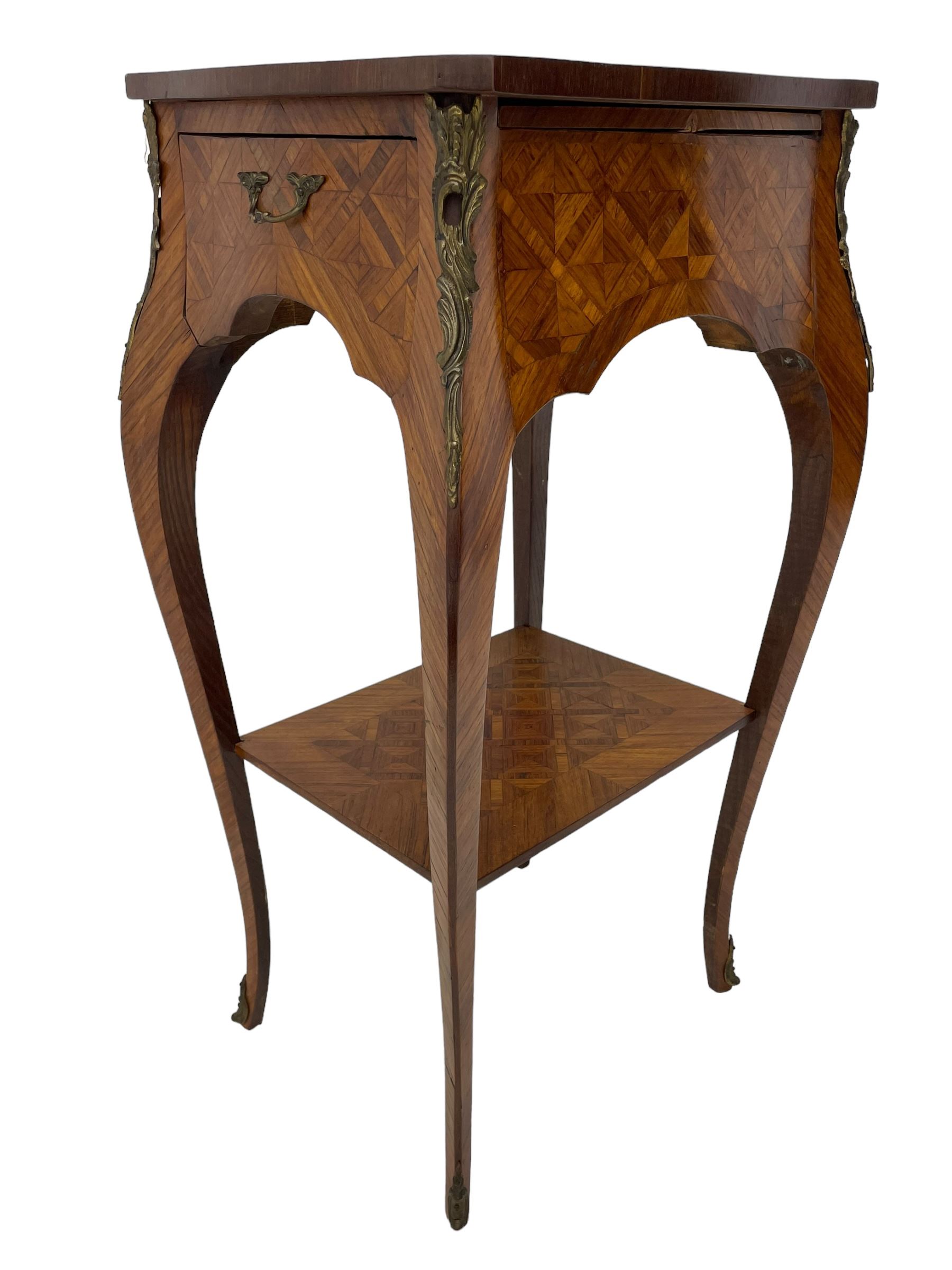 Late 20th century French design Kingwood lamp table, shaped form with geometric parquetry inlaid top within band and raised lip, fitted with single drawer and slide, on cabriole supports united by undertier, decorated with ornate cast gilt metal mounts and terminal caps 