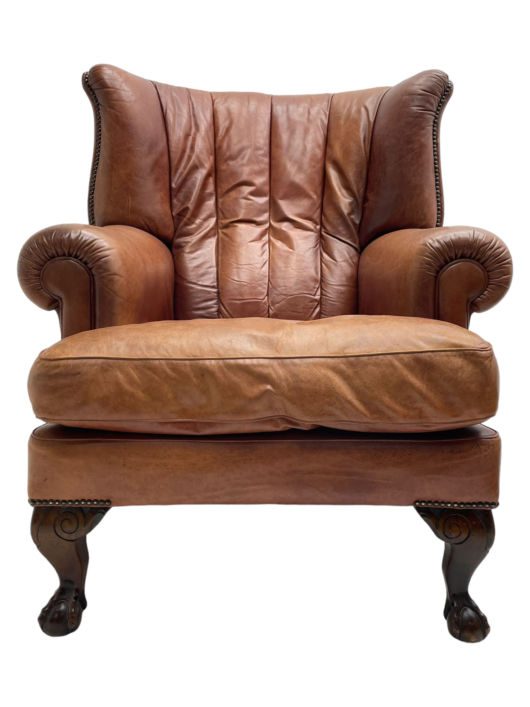 Tetrad - 'Blake' club armchair, fanned wingback and rolled arms upholstered in tan brown leather, on ball and claw carved cabriole feet 