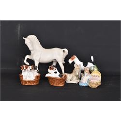 Two Royal Doulton figures of puppies in baskets, together with Beswick horse and other animal figures