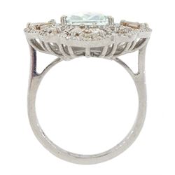 Large silver aquamarine and diamond pierced design ring, the central emerald cut aquamarine of approx 3.75 carat, with baguette and round brilliant cut diamond surround, total diamond weight approx 1.75 carat