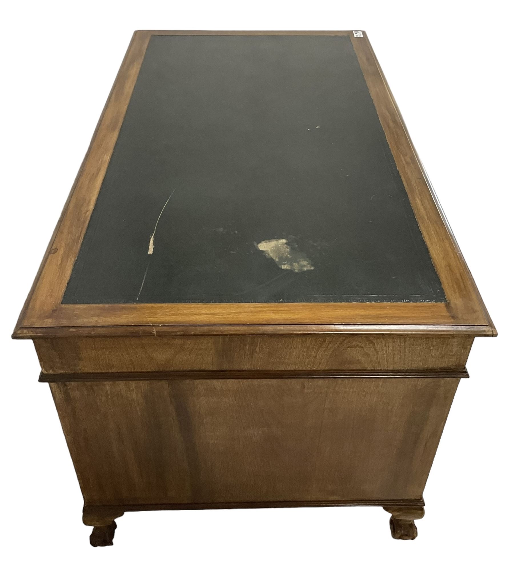 Georgian design twin pedestal desk, rectangular top with green leather inset, fitted with nine drawers, on cabriole supports with ball and claw feet 