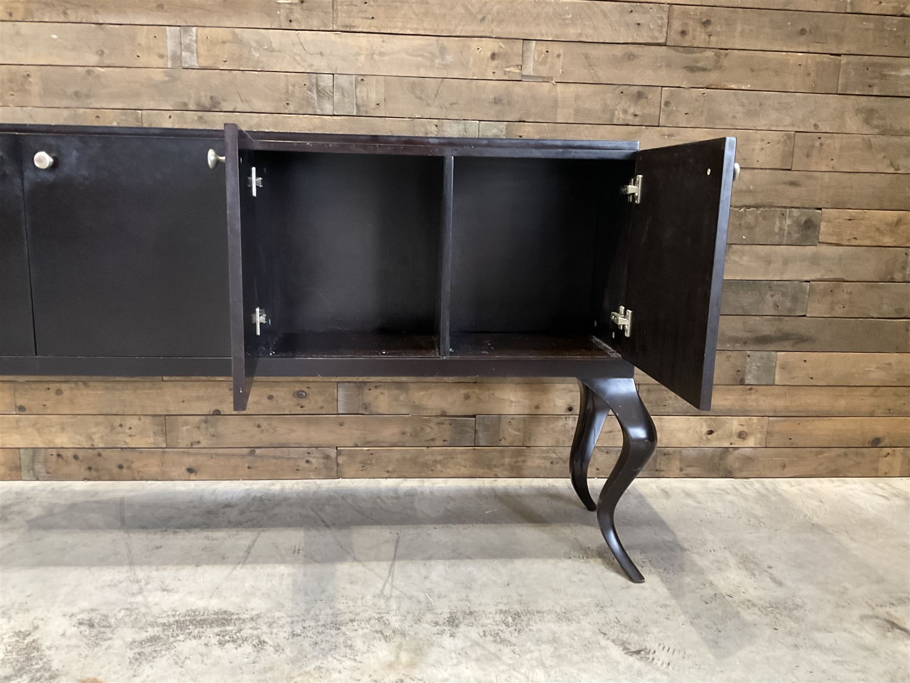 Rosewood finish four door sideboard, on cabriole legs