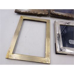 Four silver mounted photograph frames, comprising pair of early 20th century examples, and two smaller modern examples, all hallmarked, tallest H19cm