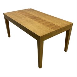 Contemporary oak dining table, rectangular top with inlaid walnut central strip, on square tapering supports 