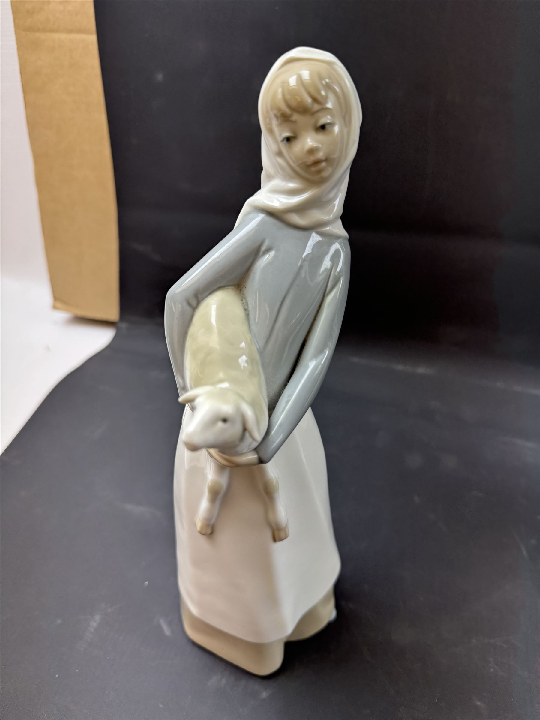 Four Lladro figures, including Girl with Lamb, Girl with Dove etc