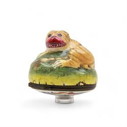 Rare 18th century Birmingham enamel bonbonniere, circa 1760, modelled as a grinning tiger laid upon a grassy sgraffito mound, the base decorated with a lion hunting scene after Antonio Tempesta, within a polychrome scroll surround, H5.5cm D6cm
