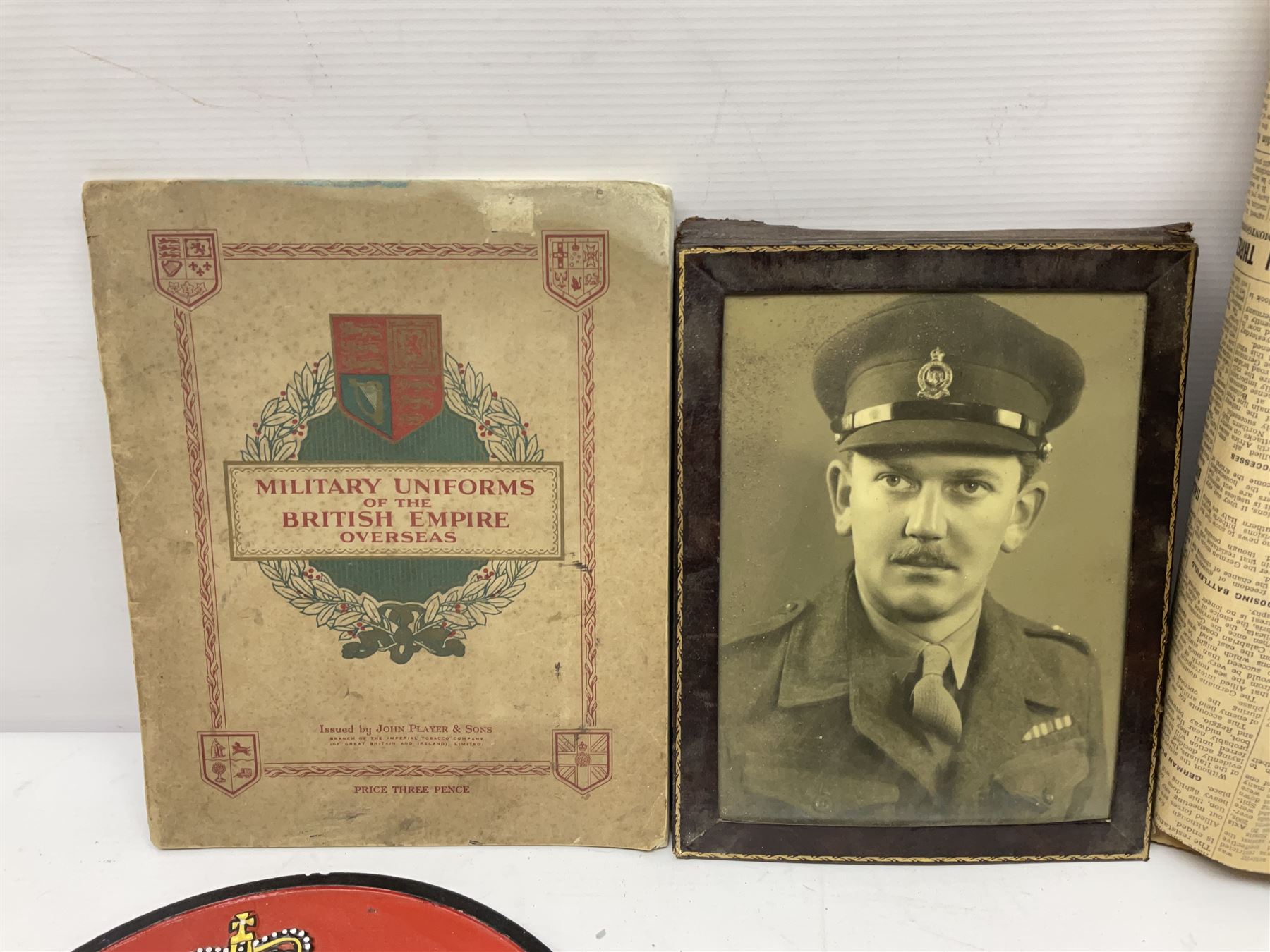 Collection on military items, including John Player & Sons Military Uniforms of the British Overseas, medal ribbon, ceramics and a reproduction metal plaque 