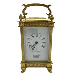 Early 20th century French carriage clock - 8-day timepiece movement in a decorative case with bevelled glass panels, white enamel dial with Roman numerals, minute markers and steel hands, retailed by Smith and Son, Scarborough, original lever platform escapement, with key.