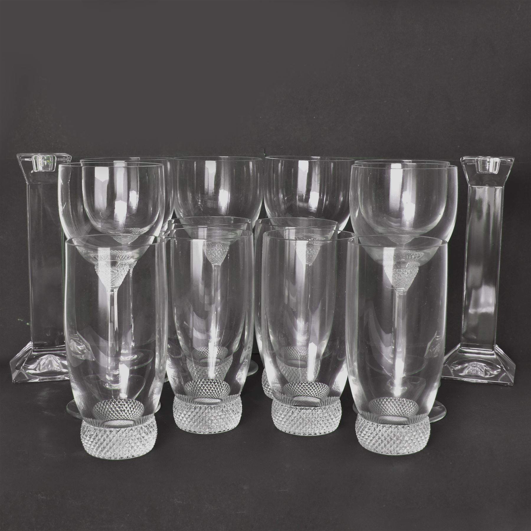 Twelve Villeroy & Boch Octavie glasses, to include six red wine glasses and six tumblers, each glass with hobnail cut decoration, together with a pair of Villeroy & Boch faceted glass candlesticks