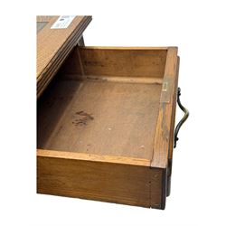 20th century oak twin pedestal desk, rectangular top with inset leather writing surface, fitted with nine drawers with chamfered edges to the raised panels, each with curved brass handles with scroll ends and keyholes, fluted detailing to the top and between the drawers, on moulded plinth base with castors