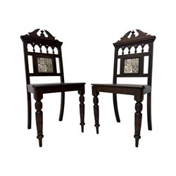 Pair of late Victorian oak hall chairs, shaped pediment over spindle turnings and tiled back, on ring turned supports 