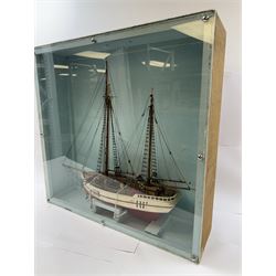 Scratch built model of a two-masted schooner, the red and white painted wooden body numbered GC-3-893, contained within wooden case, the interior painted in a light blue, with carry handle, excluding handle case H64.5cm, W67cm