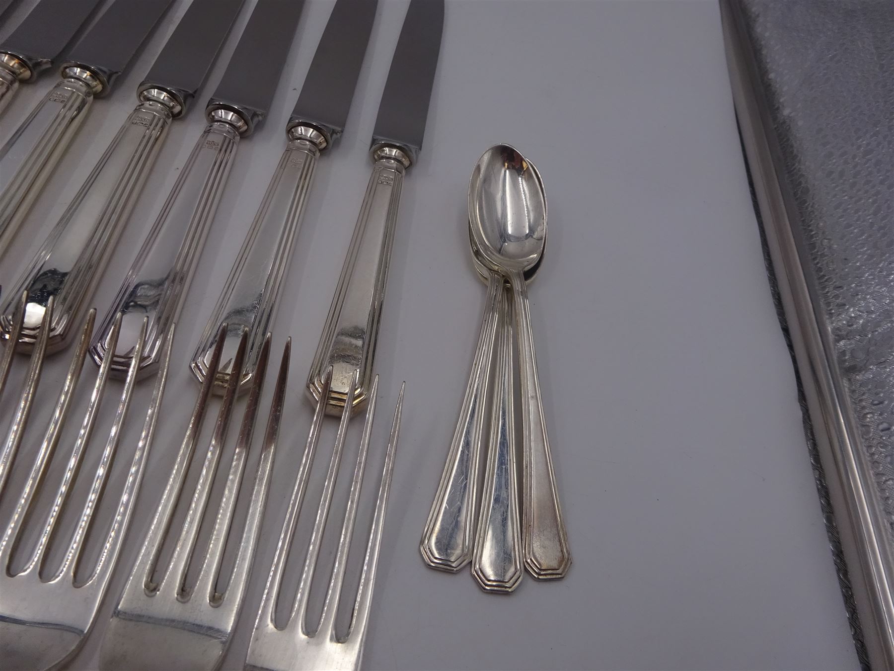 Mappin & Webb Athenian pattern silver cutlery for eight place settings, comprising table forks, silver handled table knives, dessert spoons, dessert forks, silver handled butter knives, soup spoons and teaspoons, hallmarked Mappin & Webb Ltd, Sheffield 1978, contained within anti-tarnish fabric wraps and boxed 