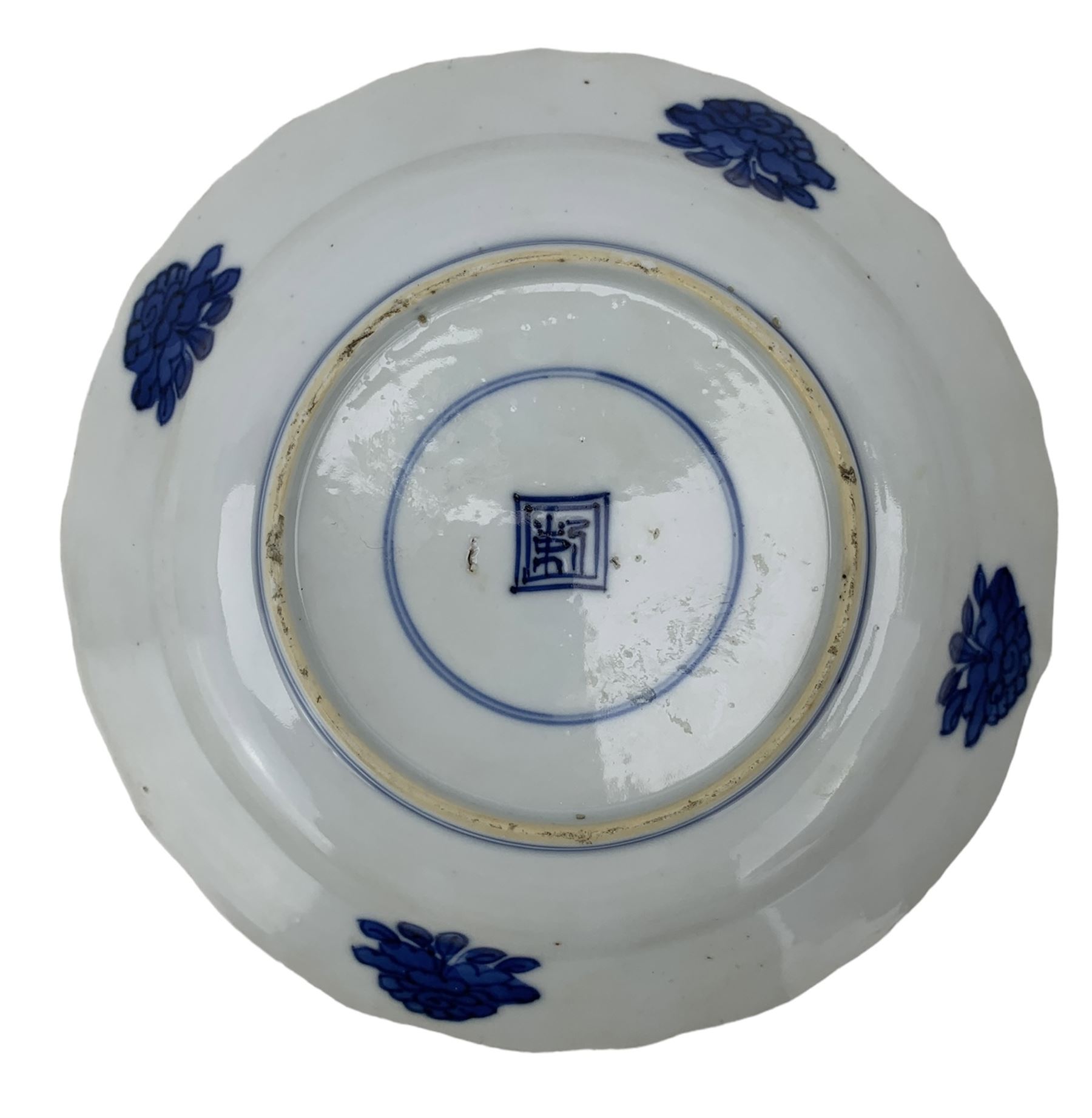 19th century Chinese blue and white saucer dish decorated in the Long Eliza pattern, four character mark within double circle beneath, D13.5cm, and a Chinese shaped dish painted with lotus flowers, provincial shop mark within square border beneath (2)