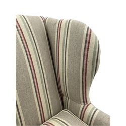 Georgian design hardwood-framed wingback armchair, curved wingback terminating to curved and rolled arms, upholstered in striped fabric with loose seat cushion, on cabriole front feet 