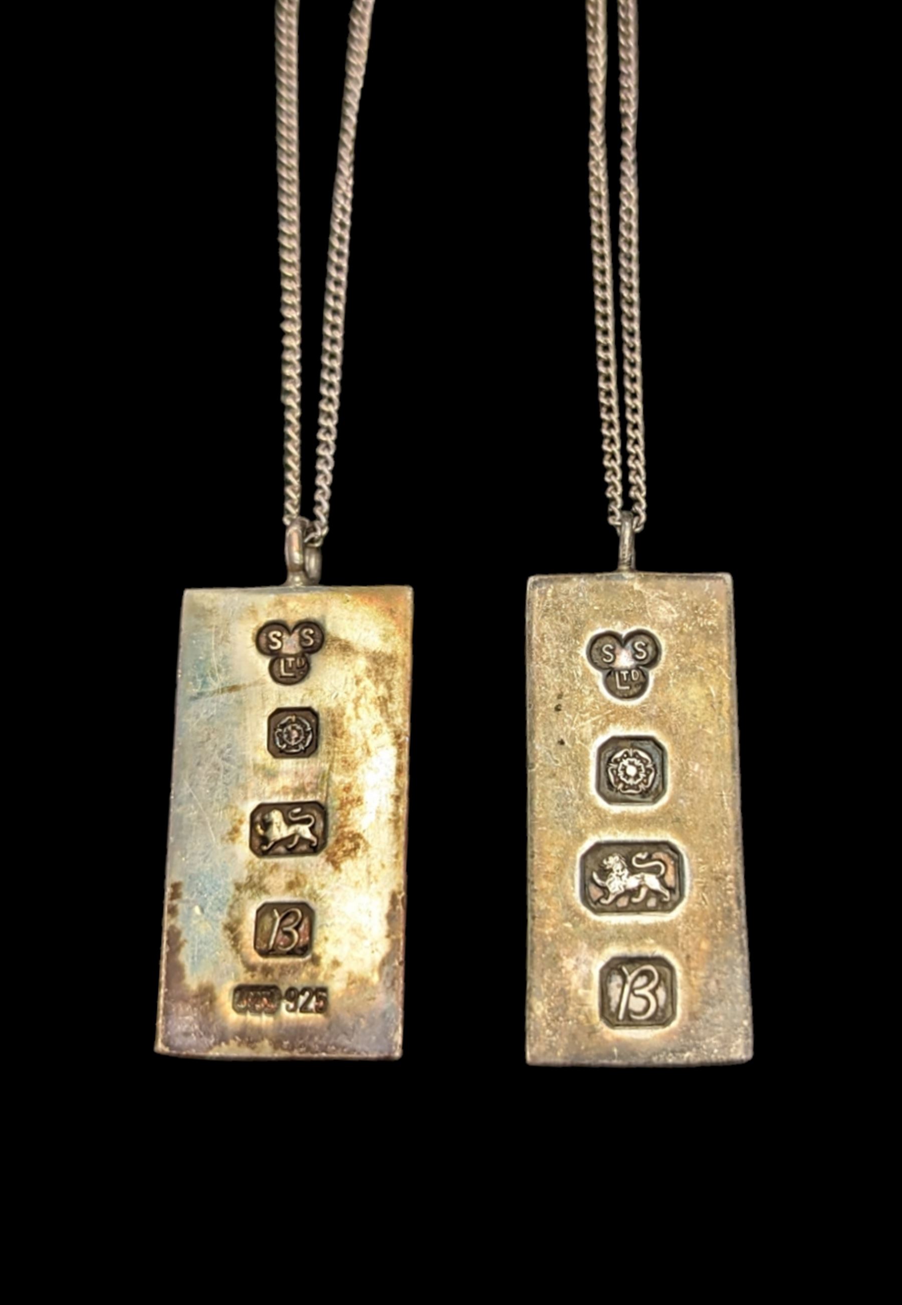 Two silver ingot pendants