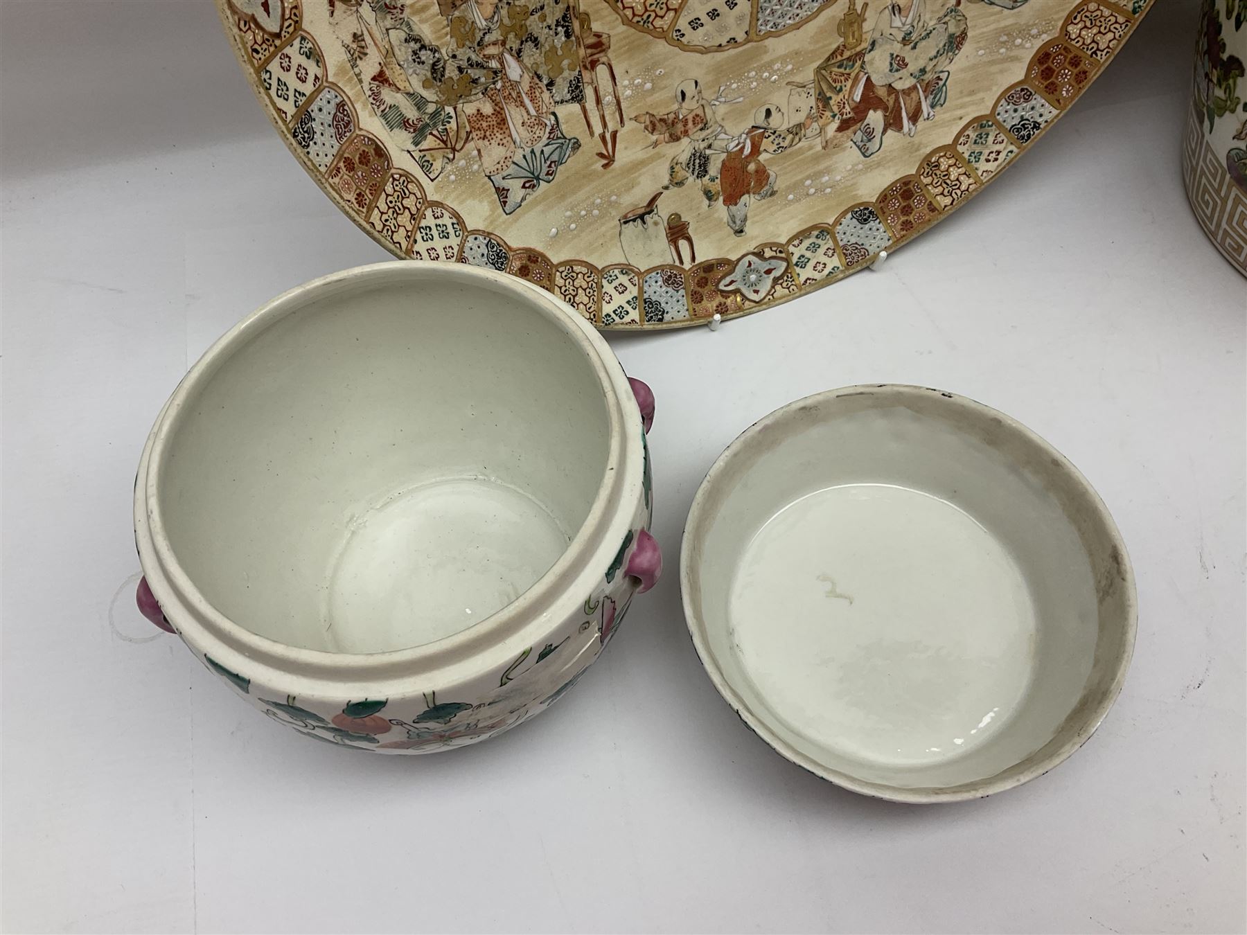 20th century Chinese famille rose jar, the body decorated in polychrome enamels with floral and foliate decoration on a white ground with a central figural panel and gilt key border to base, with six character mark beneath, H31cm, with later turned wooden cover, together with a similar footed bowl and jar,  jar cover with temple dog finial and a large Japanese Satsuma charger