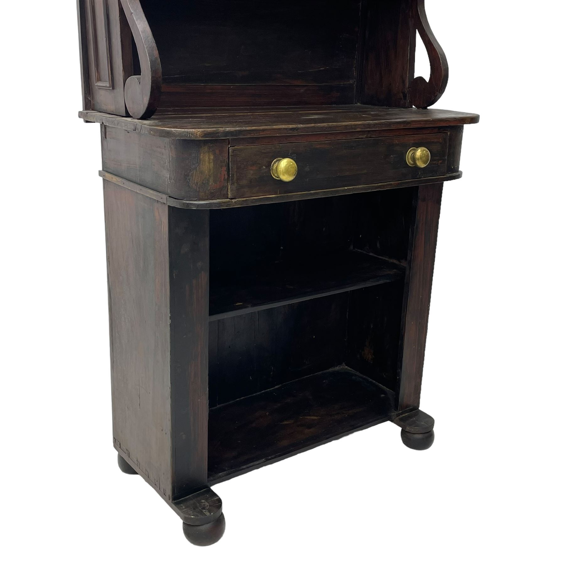 Victorian scumbled pine chiffonier, raised shaped back fitted with two shelves on S-scroll supports, rectangular top with rounded corners over single frieze drawer and open shelf, on projecting rounded sledge platforms and compressed bun feet, scumbled to resemble rosewood 