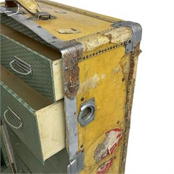 Early 20th century steamer traveling trunk, in yellow finish with chrome fixtures, the interior fitted with drawers and hangers, with various travel labels 