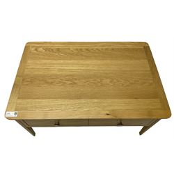 Contemporary light oak rectangular coffee table, fitted with single drawer disguised as two drawers to each side, on tapering supports