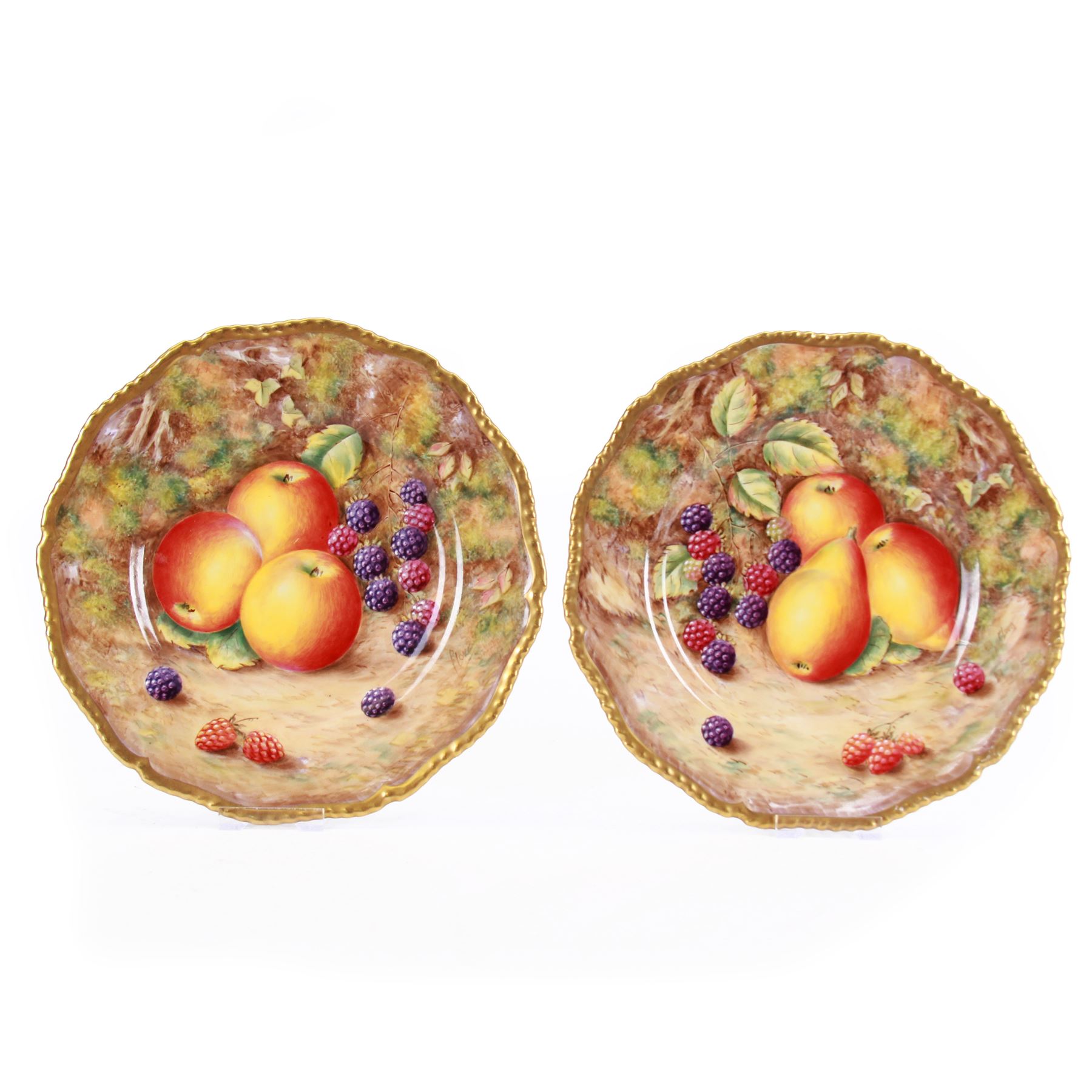 Pair of mid/late 20th century Royal Worcester cabinet plates decorated by Peter Love, each of circular form with gilt rim, each hand painted with a still life of fruit upon a mossy ground, signed P Love, each with black printed mark beneath, D26.5cm